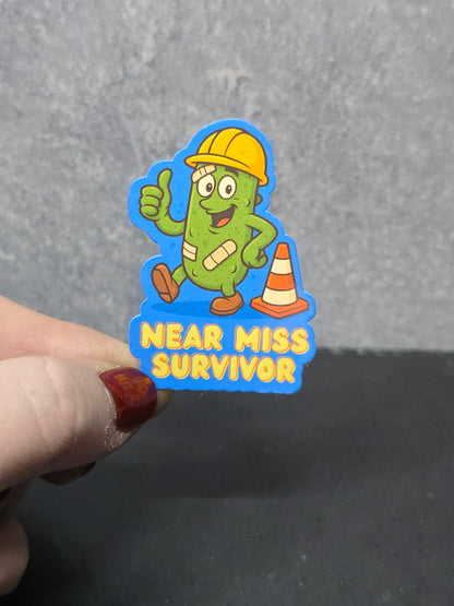 Near Miss Survivor - LDC - Bulk Pack of 16 Stickers - Apx 2in - Water Resistant Stickers